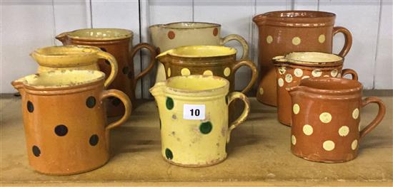 9 spotted earthenware jugs